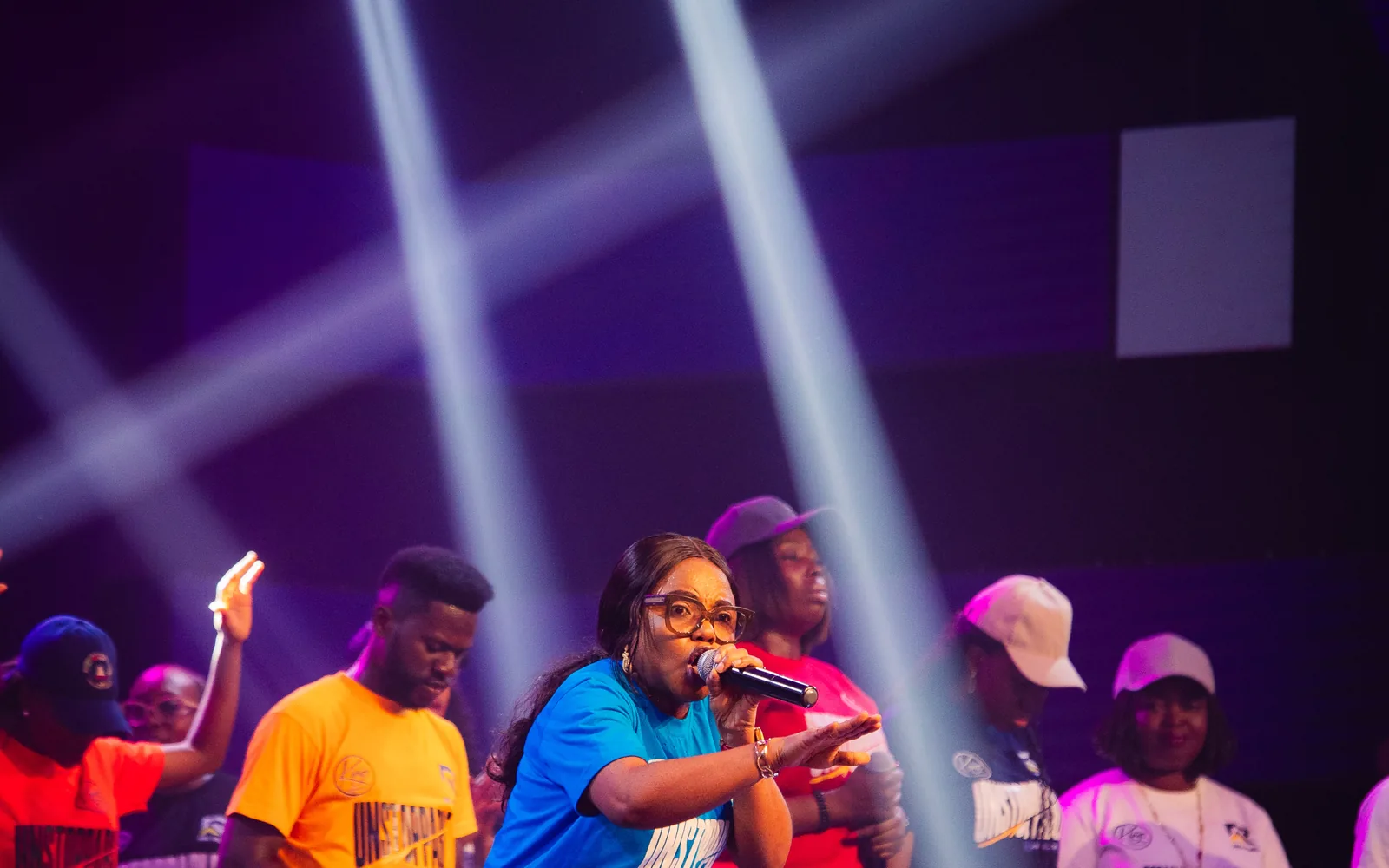 Victoria Reuben leading worship on stage